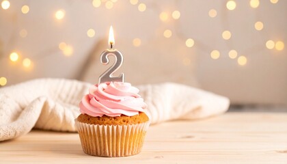 Second Birthday Celebration Pink Cupcake with Number Two Candle