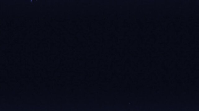 Dusty Damaged Film Texture with Light Leak Effect, Scattered Particles, Rough Lines, and Glowing Noise