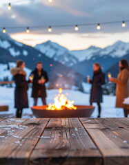 Friends enjoying warm bonfire outdoors at sunset with snowy mountains behind, ideal for lifestyle advertisement or cozy winter background design