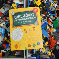 Obraz premium Educational puzzle book for first graders with colorful illustrations and fun activities