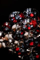 Fresh berries in the bright sun on the dessert table