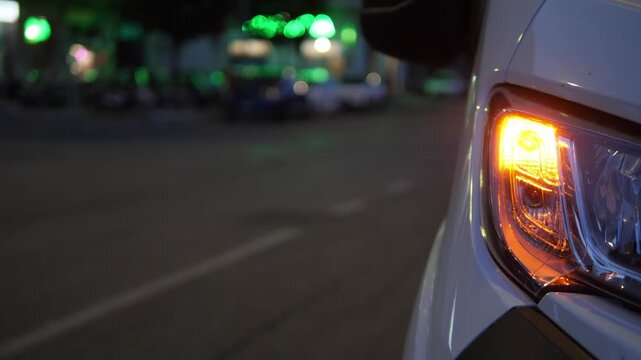 Front blinker flashes on parked van at night in restricted zone