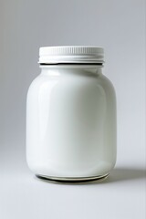 Empty, isolated glass jar or bottle, a clear pharmaceutical container for pills or medication on a white background