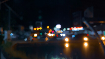 Blurred tranquil dreamy city road at night