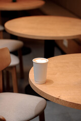 Takeaway Coffee in Cozy Café Interior