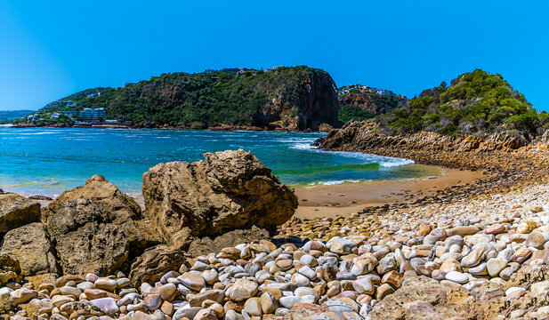 A view down a rocky shoreline towards East Head headland on the West Head headland, South Africa in Springtime - Powered by Adobe