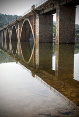 A bridge and its reflection on the water