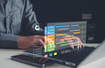 Professional using laptop with digital project management dashboard, data analytics charts, and futuristic interface representing business innovation, planning, and productivity technology.