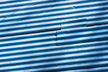 A tiled wall painted blue