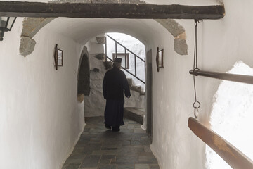 Interior of monastery,  religious paintings, arched doorway, ancient architecture, spiritual setting in the Monastery of Saint John the Theologian on the island of Patmos, Greece.