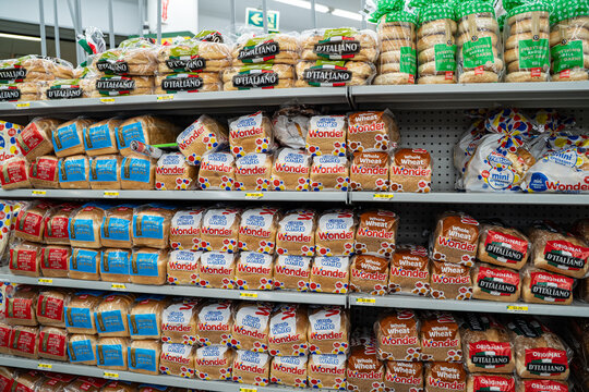 Assorted bread loaves from Wonder and D'Italiano brands on grocery store shelf. Toronto, Canada - September 18, 2025.