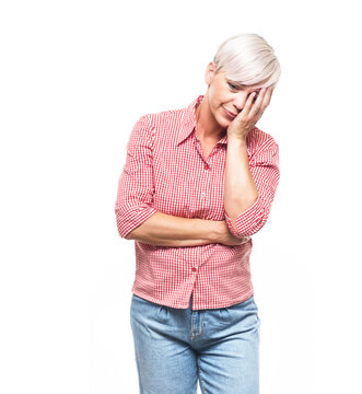 Ashamed woman covering face with hand. Shame, isolated on white background. Guilty middle aged woman.
