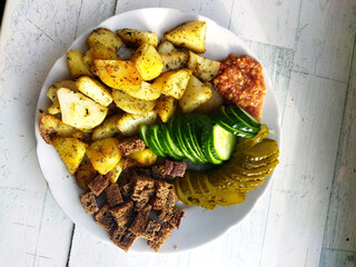 Delicious meal with seasoned potatoes and fresh vegetables