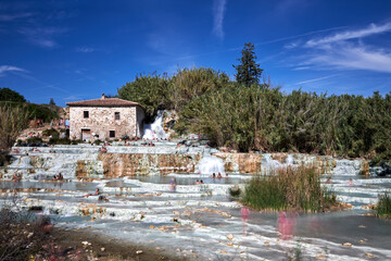 People bathing in the hot water at Terme di Saturnia in Tuscany