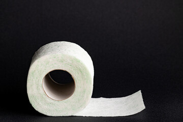 Roll of Toilet Paper with Green Pattern on Black