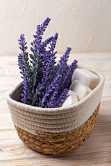 Lavender soap. Beauty and health. Lavender flowers elegantly arranged in woven basket accompanied by natural soap bars, creating serene and calming ambiance, perfect for relaxation and wellness themes