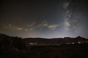 Stunning night sky over Mount Teide in Tenerife, Canary Islands. The Milky Way arches across the sky above the volcanic landscape of Teide National Park. A breathtaking astrophotography scene perfect 