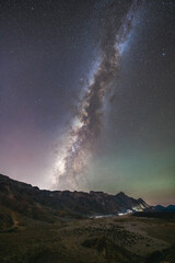 Stunning night sky over Mount Teide in Tenerife, Canary Islands. The Milky Way arches across the sky above the volcanic landscape of Teide National Park. A breathtaking astrophotography scene perfect 