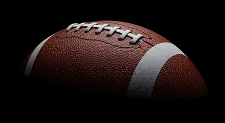 American football ball on a black background