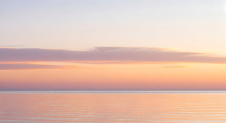 Obraz premium Soft Pastel Sunset Over A Calm Ocean Horizon water