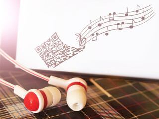 Headphones and a smartphone with an image of notes.