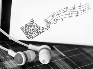 Headphones and a smartphone with an image of notes.