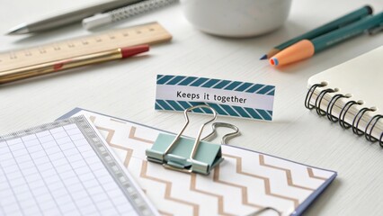 Stylish Desk Arrangement with Stationery and Motivational Note