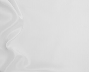 Smooth elegant white silk or satin luxury cloth texture as wedding background. Luxurious background design