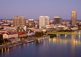 Fototapeta premium Dusk Bratislava city skyline with Danube river reflections, Slovakia