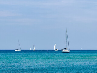 Fototapeta premium Sailboats on a Calm Blue Sea