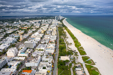 Fototapeta premium Miami Beach Florida. Ocean Drive. Panorama of South Miami Beach FL. Atlantic Ocean. Cityscape, seascape. Big American city. Summer vacation in Florida. Aerial view on hotels and resorts on Island