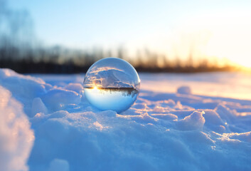 winter landscape with magic crystal ball on snow, nature background. spiritual healing crystal practice. witchcraft, magic ritual for winter solstice, Yule. Christmas, new year wonderful season