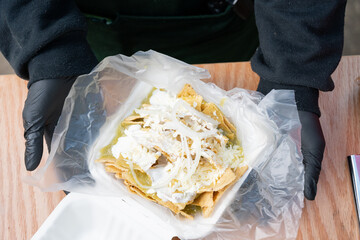 Chilaquiles with Green Sauce, Cream, Cheese, and Onion