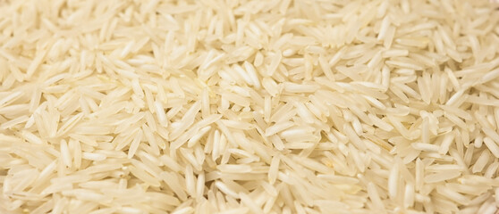 Close-up texture of uncooked Basmati rice. food backgrounds, culinary visuals.