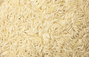 Close-up texture of uncooked Basmati rice. food backgrounds, culinary visuals.