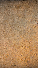 macro photo of an orange brick with visible texture. background