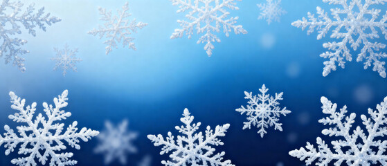 Snowflakes falling against a blue background in winter setting  