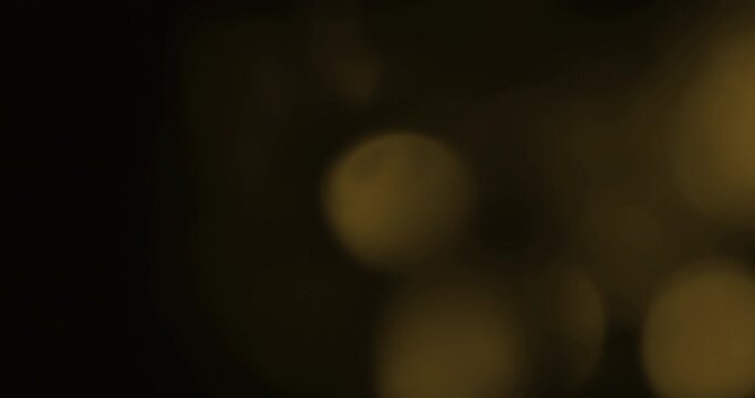 golden glittering christmas background floating with bokeh, gold holiday happy new year