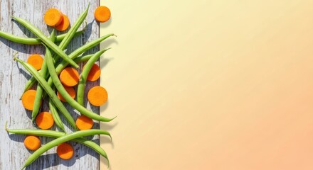 Fresh green beans and carrot slices on wooden board with copy space background