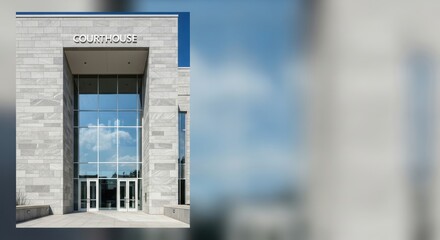 Front view of modern courthouse architecture with large windows
