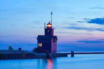 Fototapeta premium red lighthouse at dusk