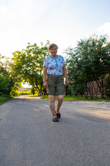 Fototapeta premium Old woman hurts her knee. Selective focus.