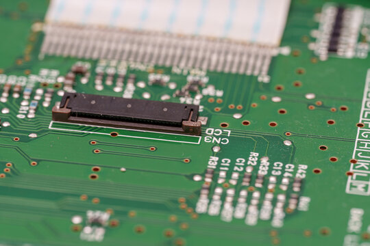 Emerald electronic labyrinth a close-up view of a circuit board with components and copper traces forming intricate pathways