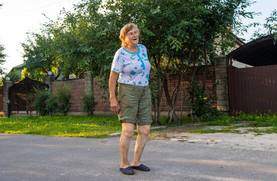 Old woman has back pain. Selective focus.