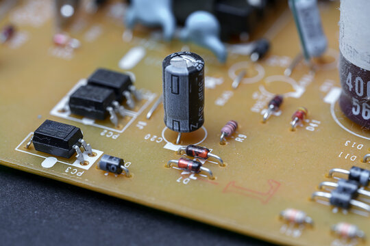 Electronic components on circuit board demonstrate intricate design, displaying resistors, diodes, capacitors and transistors