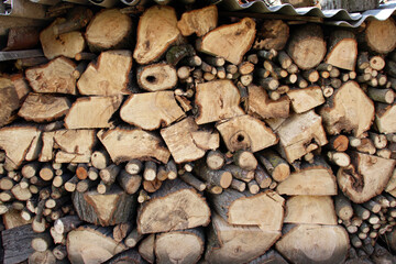 Cut and chopped firewood are stacked together