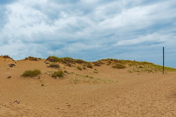 sand dunes and cloud filled sky