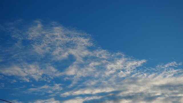 Altocumulus high cumulus heaped cloud genus strato cumuliform. Globular masses or rolls in layers or patches. Cumuliform stratocumuliform clouds, altocumulus signifies convection. Blue sky. Sunlight.