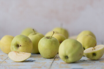 Golden apples on ceramic tile background, perfect for grocery marketing, farm-to-table promotions, or seasonal food campaigns.