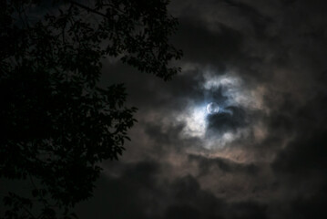 Mysterious Moon Behind Dark Clouds